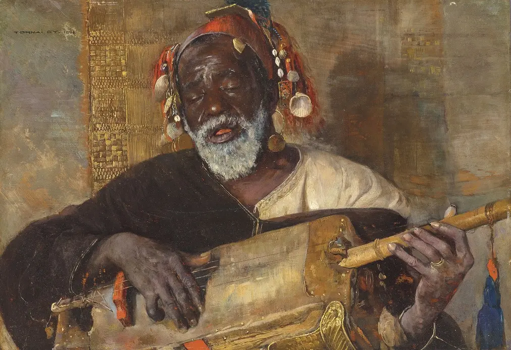 Maâlem playing guembri in ceremony